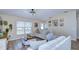 Spacious living room with vaulted ceilings and plenty of natural light at 6867 Shadowcast Ln, Lakeland, FL 33813