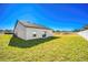 Spacious backyard with grassy area and new home at 13470 Leaping Water Way, Astatula, FL 34705