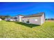 Large backyard with grassy lawn and new construction homes at 13470 Leaping Water Way, Astatula, FL 34705