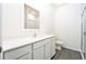 Clean bathroom with white vanity, shower, and gray flooring at 13470 Leaping Water Way, Astatula, FL 34705
