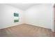 Spacious bedroom with neutral carpeting and large window at 13470 Leaping Water Way, Astatula, FL 34705