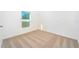Well-lit bedroom with neutral carpet and a large window at 13470 Leaping Water Way, Astatula, FL 34705