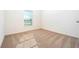 Simple bedroom with neutral-toned carpet and a window with blinds at 13470 Leaping Water Way, Astatula, FL 34705
