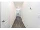 Clean and spacious hallway featuring gray vinyl flooring and white walls at 13470 Leaping Water Way, Astatula, FL 34705