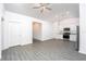 Open concept kitchen with stainless steel appliances and gray flooring at 13470 Leaping Water Way, Astatula, FL 34705