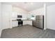 Modern kitchen with stainless steel appliances and granite countertops at 13470 Leaping Water Way, Astatula, FL 34705