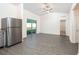 Modern kitchen features stainless steel appliances and gray laminate flooring at 13470 Leaping Water Way, Astatula, FL 34705