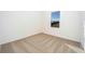 Bright bedroom with carpeted floor and window at 13474 Leaping Water Way, Astatula, FL 34705