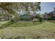 Expansive backyard with a screened pool and patio, perfect for outdoor entertaining at 1111 Royal Ridge Dr, Davenport, FL 33896
