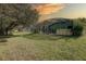 Large backyard with screened pool and patio, providing ample space for recreation at 1111 Royal Ridge Dr, Davenport, FL 33896