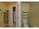 Clean bathroom with toilet, storage, and closet at 1111 Royal Ridge Dr, Davenport, FL 33896
