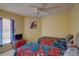 Bedroom with two twin beds, a TV, and Spiderman themed bedding at 1111 Royal Ridge Dr, Davenport, FL 33896