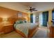 Spacious bedroom with wood furniture and a ceiling fan at 1111 Royal Ridge Dr, Davenport, FL 33896