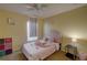 Cozy bedroom with a twin-size bed and colorful decor at 1111 Royal Ridge Dr, Davenport, FL 33896