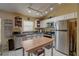 Kitchen with white cabinets, stainless steel appliances, and an island at 1111 Royal Ridge Dr, Davenport, FL 33896