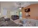Living room with brown leather couches and a large TV at 1111 Royal Ridge Dr, Davenport, FL 33896