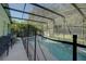 Screened-in pool and spa with safety fence at 1111 Royal Ridge Dr, Davenport, FL 33896