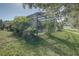 Screened pool and patio area with lush landscaping, providing privacy and shade at 1111 Royal Ridge Dr, Davenport, FL 33896