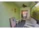 Relaxing screened porch with seating and a game at 1111 Royal Ridge Dr, Davenport, FL 33896