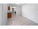 Dining area adjacent to kitchen with tile flooring and ample space at 830 Copperleaf Ln, Bartow, FL 33830