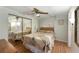 Cozy bedroom with mirrored closet doors and light wood flooring at 1610 Reynolds Rd # 159, Lakeland, FL 33801