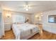 Main bedroom with wood flooring, dresser and en-suite bathroom at 1610 Reynolds Rd # 159, Lakeland, FL 33801