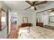 Bedroom with wood floors, mirrored closet and en-suite bathroom at 1610 Reynolds Rd # 159, Lakeland, FL 33801