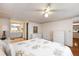 Main bedroom with wood floors, dresser and en-suite bathroom at 1610 Reynolds Rd # 159, Lakeland, FL 33801