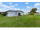 Side view of manufactured home showcasing backyard at 1610 Reynolds Rd # 159, Lakeland, FL 33801