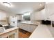 View of kitchen with white cabinets and appliances at 1610 Reynolds Rd # 159, Lakeland, FL 33801