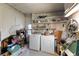 Laundry room with washer, dryer, and storage shelves at 1610 Reynolds Rd # 159, Lakeland, FL 33801