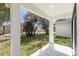Covered back patio with view of fenced backyard at 1312 Congo Dr, Poinciana, FL 34759