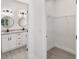 Clean and bright bathroom with a walk-in shower and double vanity at 1312 Congo Dr, Poinciana, FL 34759