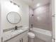 Clean bathroom with single vanity, granite countertop and a bathtub at 1312 Congo Dr, Poinciana, FL 34759