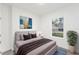 Bedroom with a grey upholstered bed and brown bedding at 1312 Congo Dr, Poinciana, FL 34759