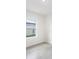 Empty bedroom with grey tile floor and a window at 1312 Congo Dr, Poinciana, FL 34759