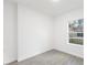 Simple bedroom with grey tile flooring and a window at 1312 Congo Dr, Poinciana, FL 34759