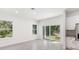 Spacious dining area with large windows and hardwood floors at 1312 Congo Dr, Poinciana, FL 34759