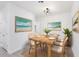 Charming dining room with rustic wooden table and wicker chairs at 1312 Congo Dr, Poinciana, FL 34759