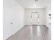 Bright and airy entryway with gray tile floors and white walls at 1312 Congo Dr, Poinciana, FL 34759