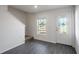 Inviting entryway with grey vinyl flooring, a window, and a glass-paneled door at 563 Bay Leaf Dr, Poinciana, FL 34759