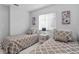 Guest bedroom with twin beds and plenty of closet space at 2622 Montego Bay Blvd, Kissimmee, FL 34746