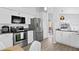 Well-equipped kitchen with stainless steel appliances and granite countertops at 2622 Montego Bay Blvd, Kissimmee, FL 34746