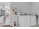 Convenient laundry room with washer and dryer, near kitchen at 2622 Montego Bay Blvd, Kissimmee, FL 34746