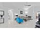 Open concept living room, featuring tile floors and a view of the bathroom at 2622 Montego Bay Blvd, Kissimmee, FL 34746