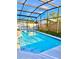 Inviting screened pool with ample surrounding space at 2622 Montego Bay Blvd, Kissimmee, FL 34746