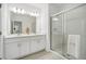 Bright bathroom with double vanity and shower at 33916 Sky Blossom Circle, Leesburg, FL 34788