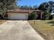 House exterior showcasing a red tile roof and driveway at 901 Hickory Rd, Ocala, FL 34472