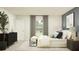 Second bedroom with a queen bed and stylish decor at 2033 Lasso Loop, Eagle Lake, FL 33839