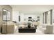 Spacious living room with sectional sofa and large windows at 2033 Lasso Loop, Eagle Lake, FL 33839